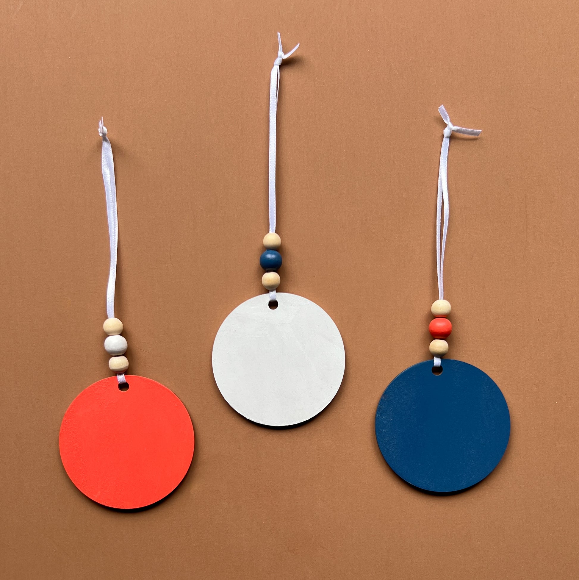 At the Seashore Beachy Set. Three wood ornaments featuring a shell, a seahorse, or a starfish. Summer decor, year-round holiday tree ornament, or gift.
