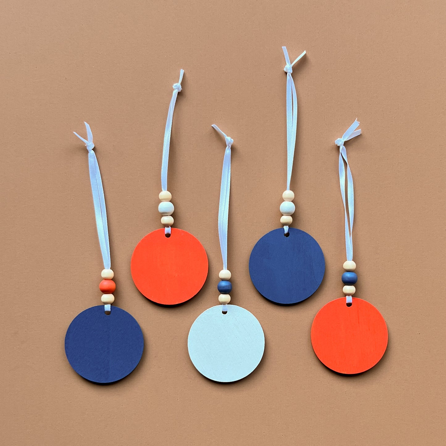 Calm Little Seas Handmade Ornament Set of 5. Ornaments feature ocean themed shapes – a fish, a sailboat, a ship anchor, a lighthouse, and a whale. Summer seasonal decor; year-round tree ornaments or gifts.