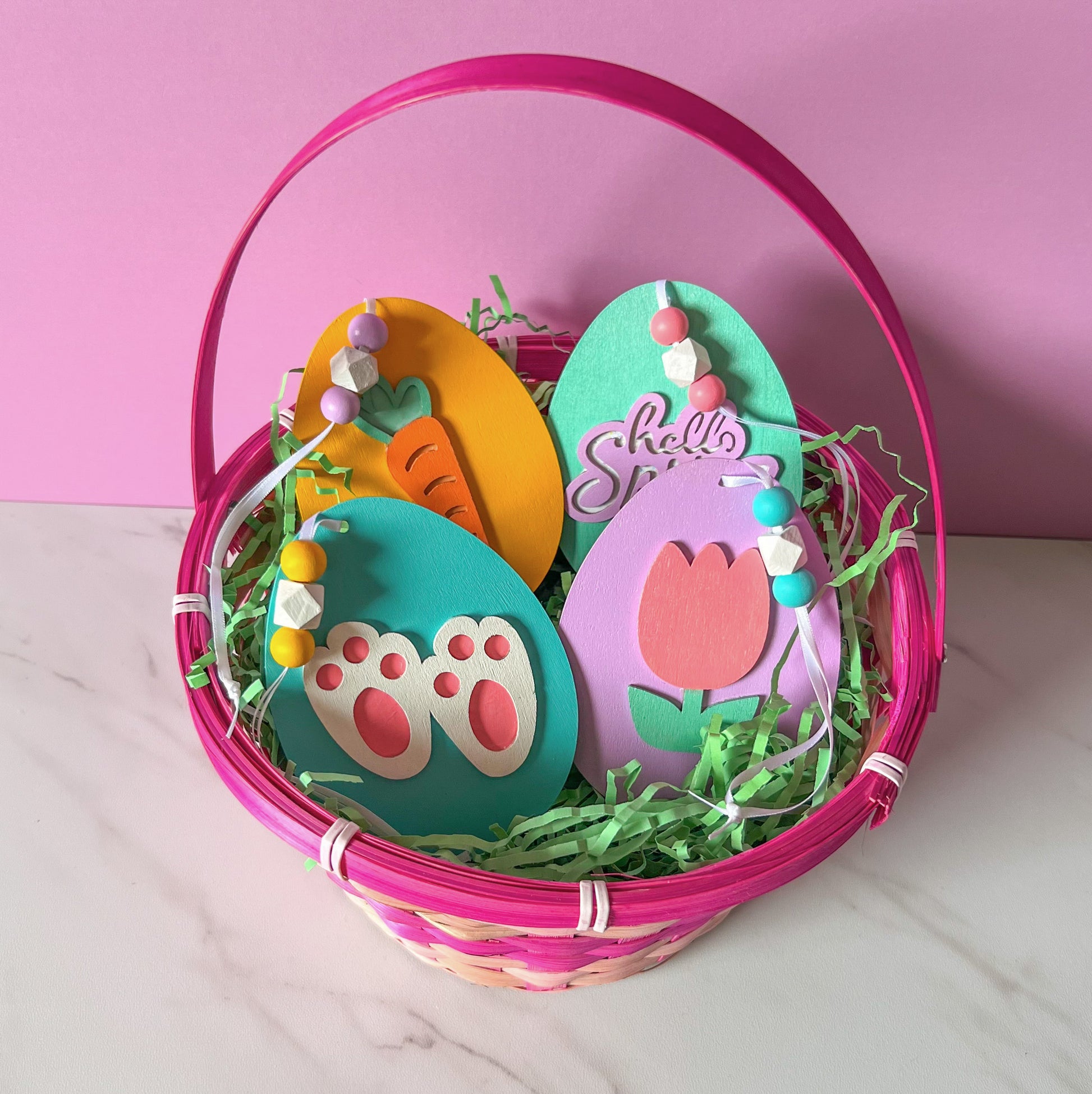 Hello Spring Handmade Ornaments. Flat egg shape ornaments with spring and Easter themed shapes - carrots, flower, rabbit paws. Spring decoration or gift.
