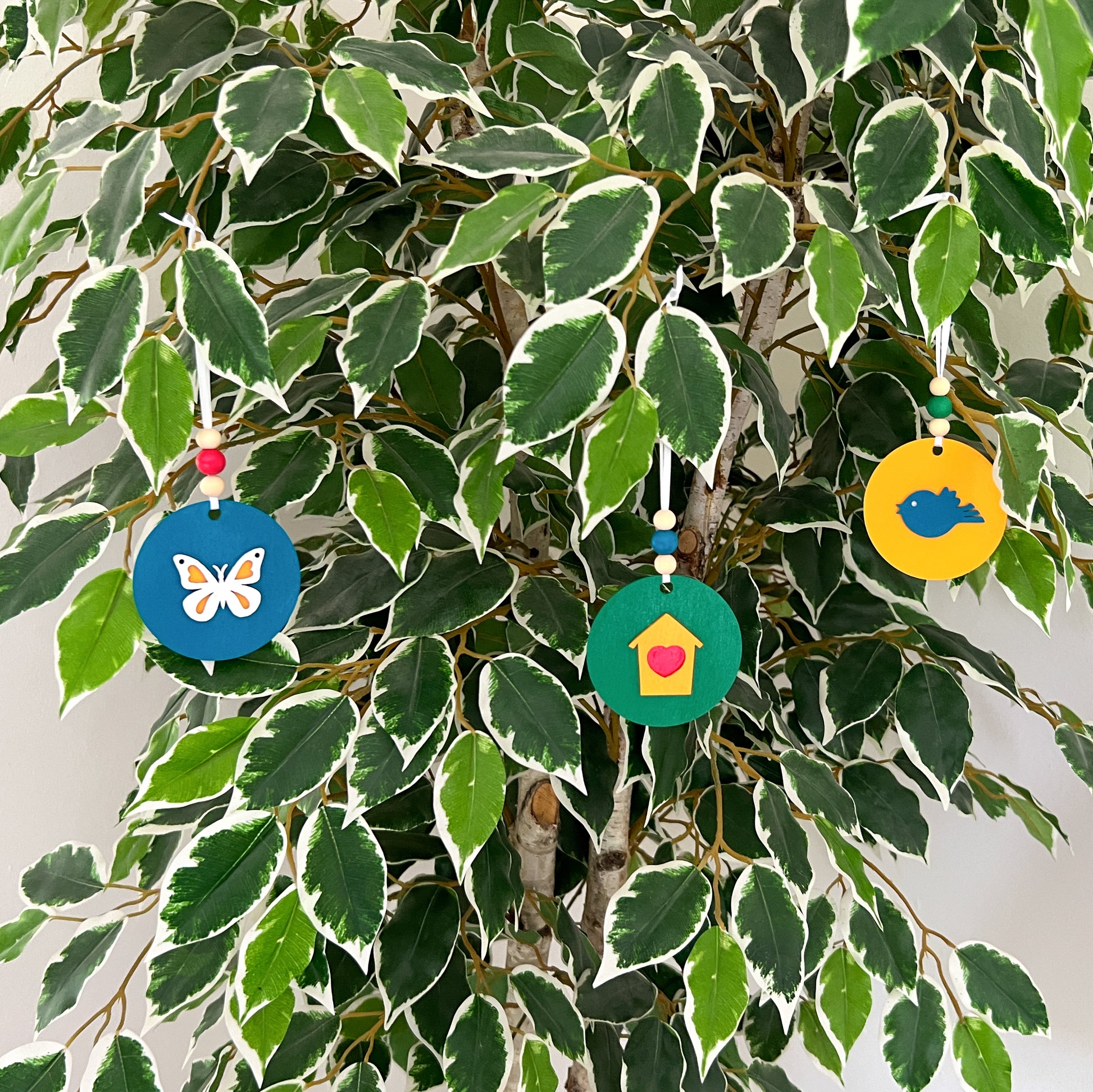 In the Garden Ornament Set. Three ornaments featuring a bird, birdhouse, butterfly. Year-round holiday tree, spring decor or gift.