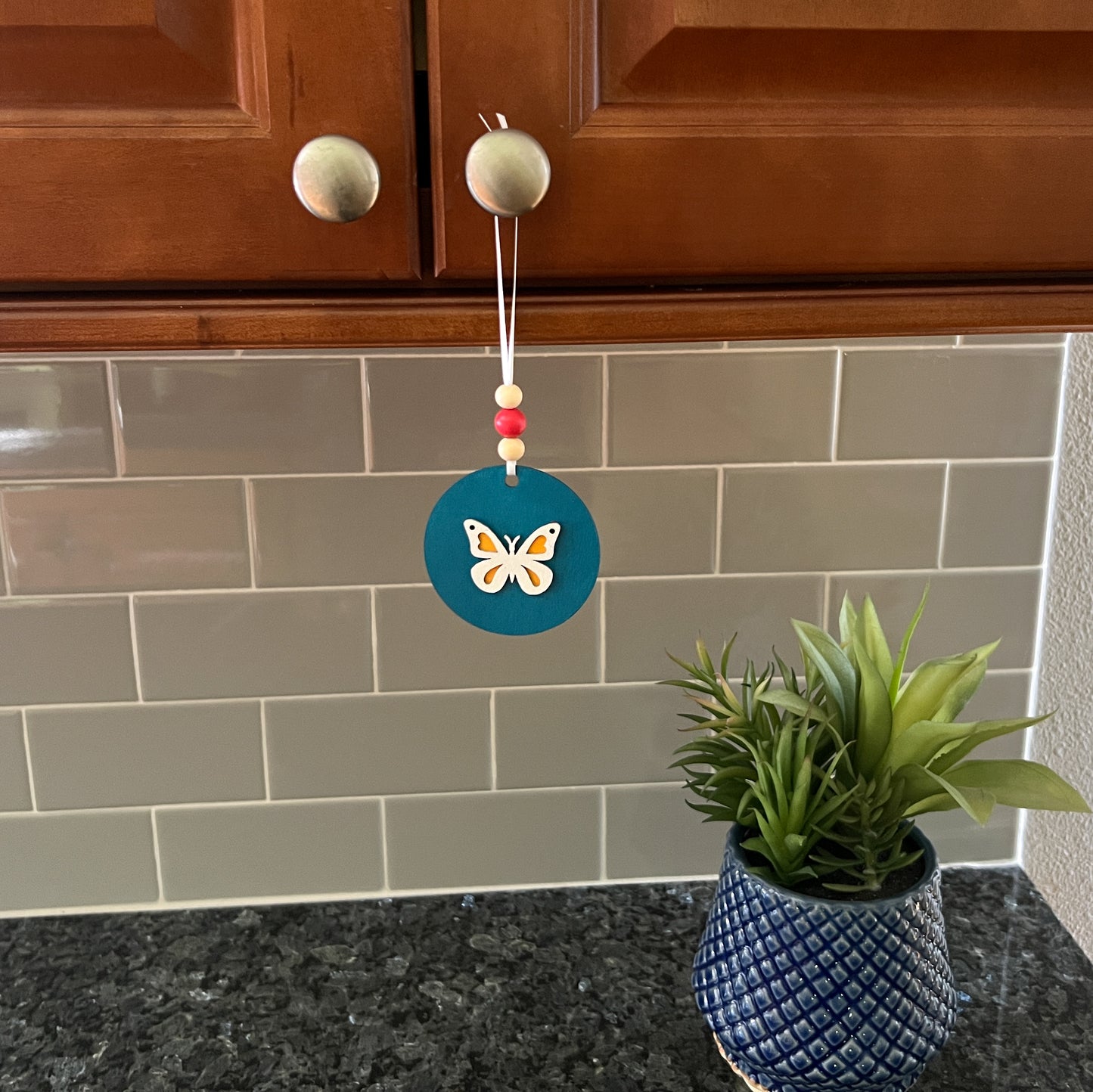 In the Garden Ornament Set. Three ornaments featuring a bird, birdhouse, butterfly. Year-round holiday tree, spring decor or gift.