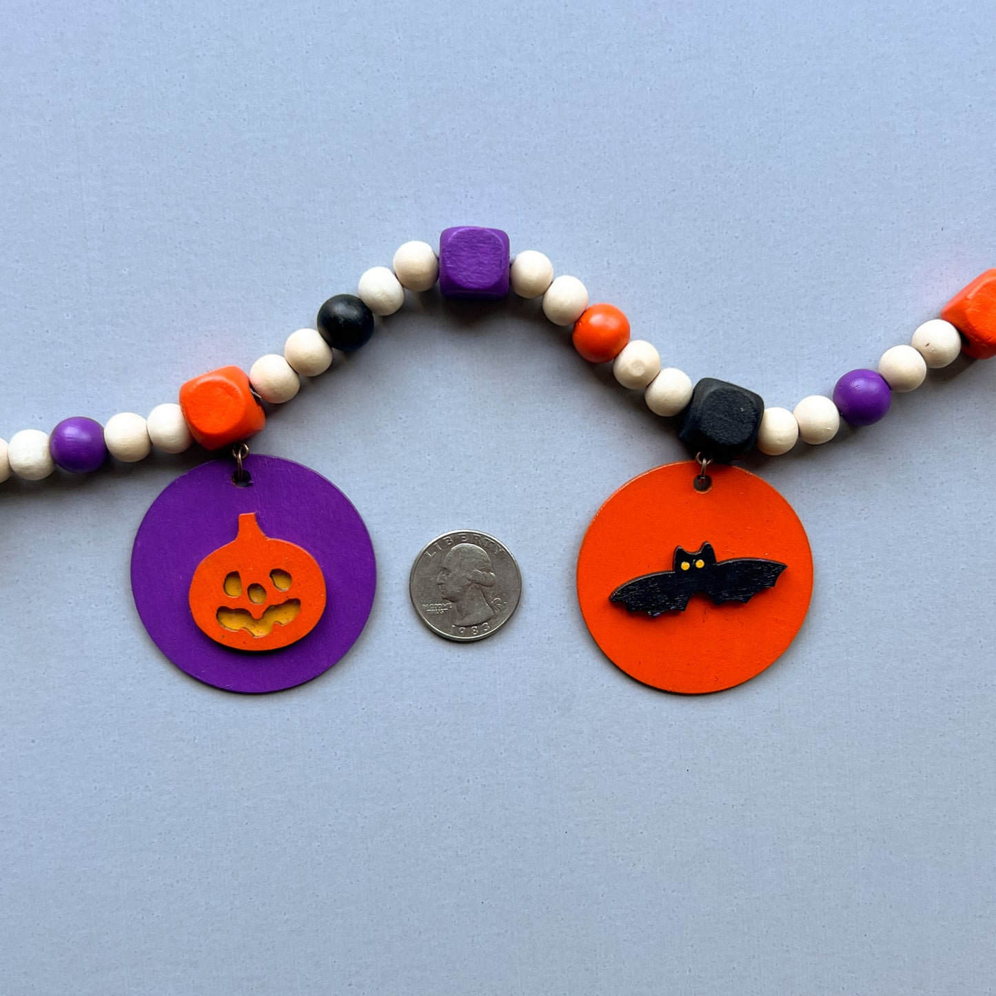 Little Boo Handmade Mini Garland. Features five flat wood circles with a ghost, a witches hat, a "boo" cutout, a jack-o-lantern, or a bat. Halloween fall seasonal decor and gifts.