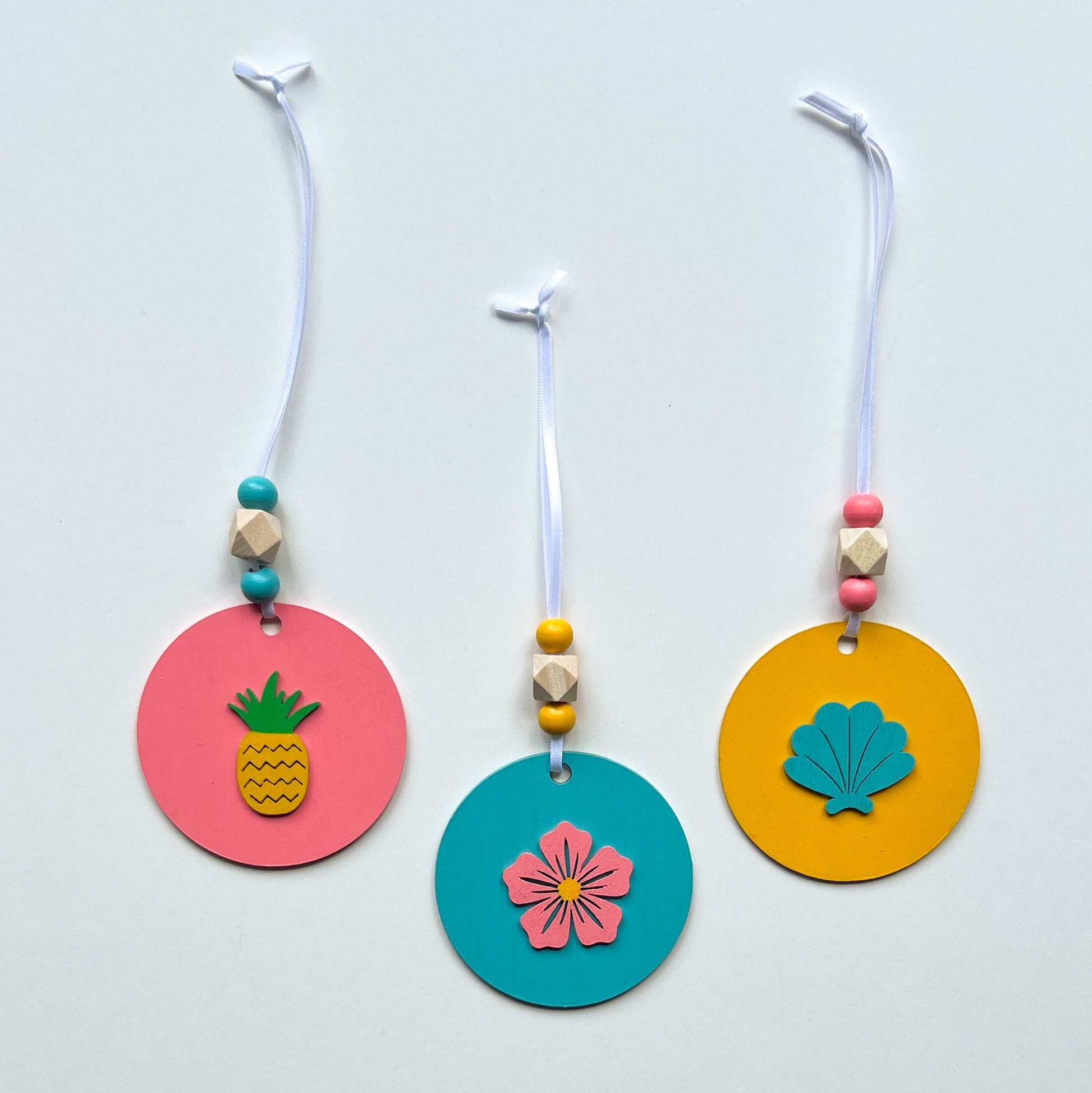 Summer Vacay Ornament Tropical Set. Wood ornaments with a pineapple, a flower, or a shell. Summer tropical decor or gift; year-round holiday tree decoration.