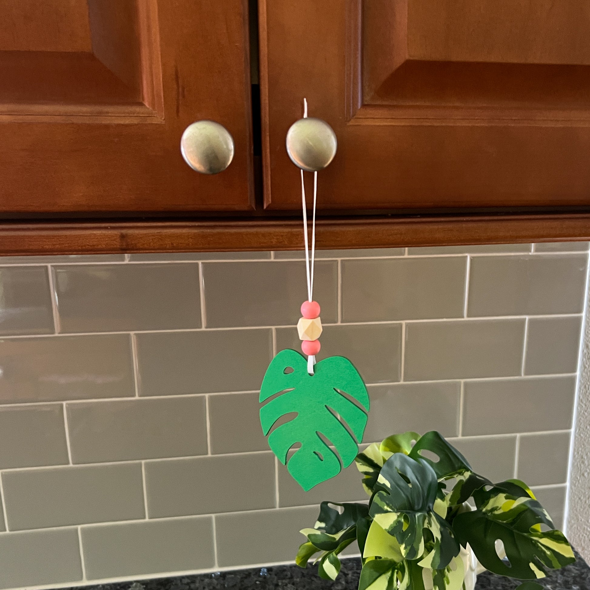 Tropical Breeze Handmade Ornament Set of 3. Wood monstera leaf ornaments with wood beads. Summer, tropical themed home decor and gifts.