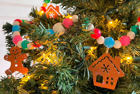 Decorated Christmas tree with Christmas themed handmade ornament garland