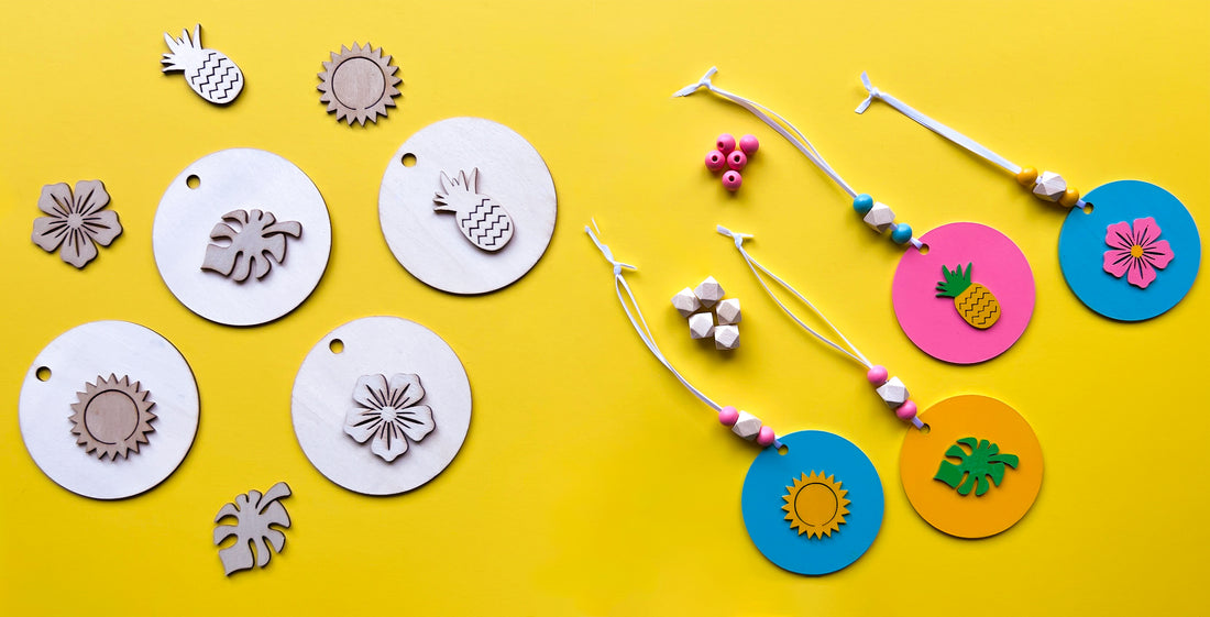 Image showing unfinished wood circles, summer themed shapes, and wood beads alongside finished ornaments made out of those raw materials.