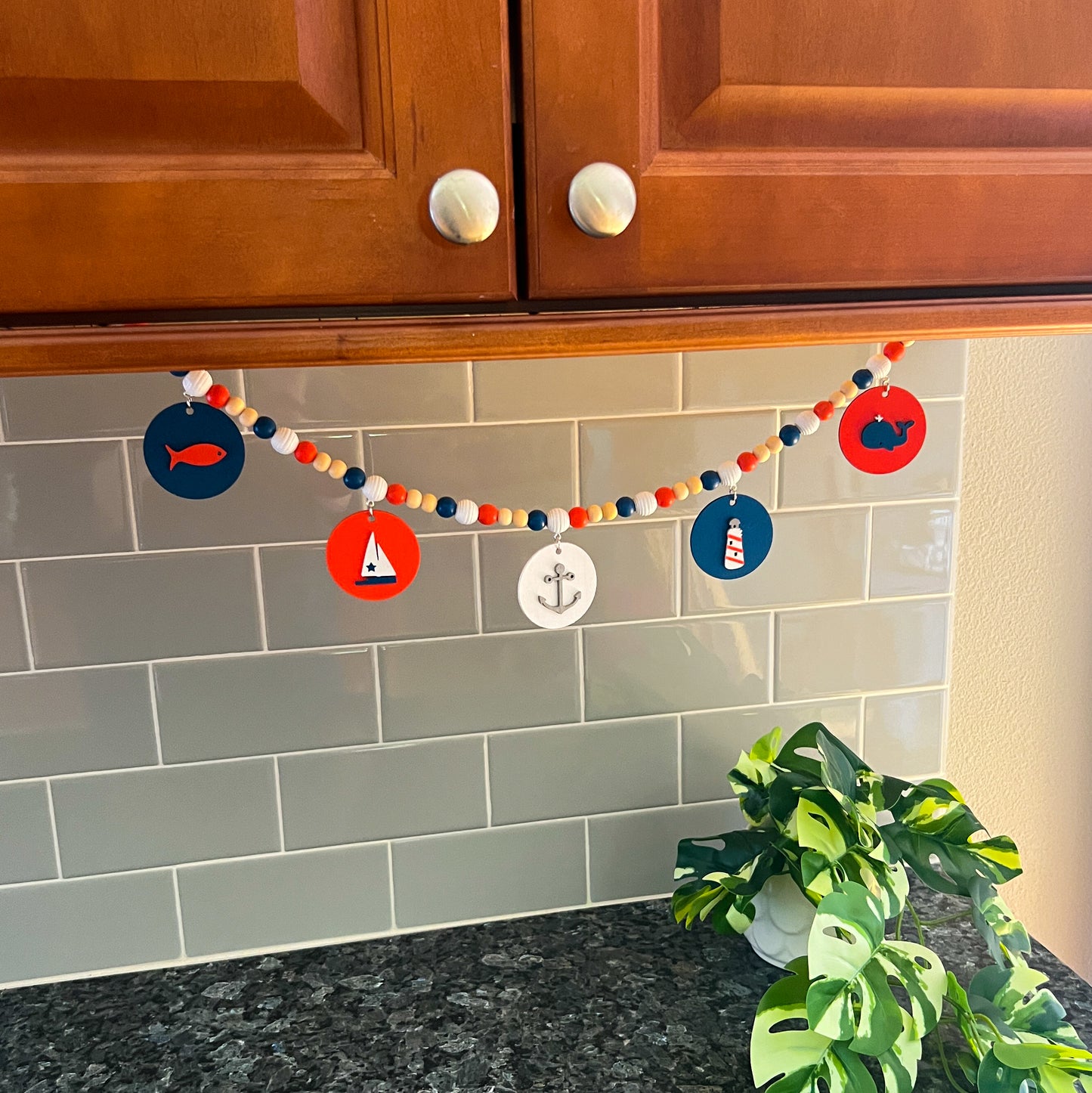 Calm Little Seas Handmade Mini Garland. Features wood circles with a fish, sailboat, anchor, lighthouse, whale. Summer nautical beachy decor or gfits.