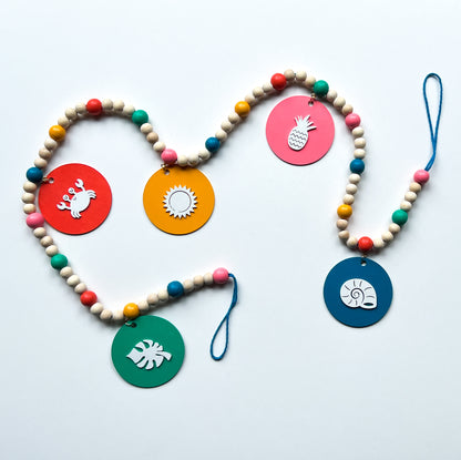 Fun in the Sun Handmade Garland. Features shapes with a leaf, crab, sun, pineapple, shell. Summer seasonal decor or gifts.