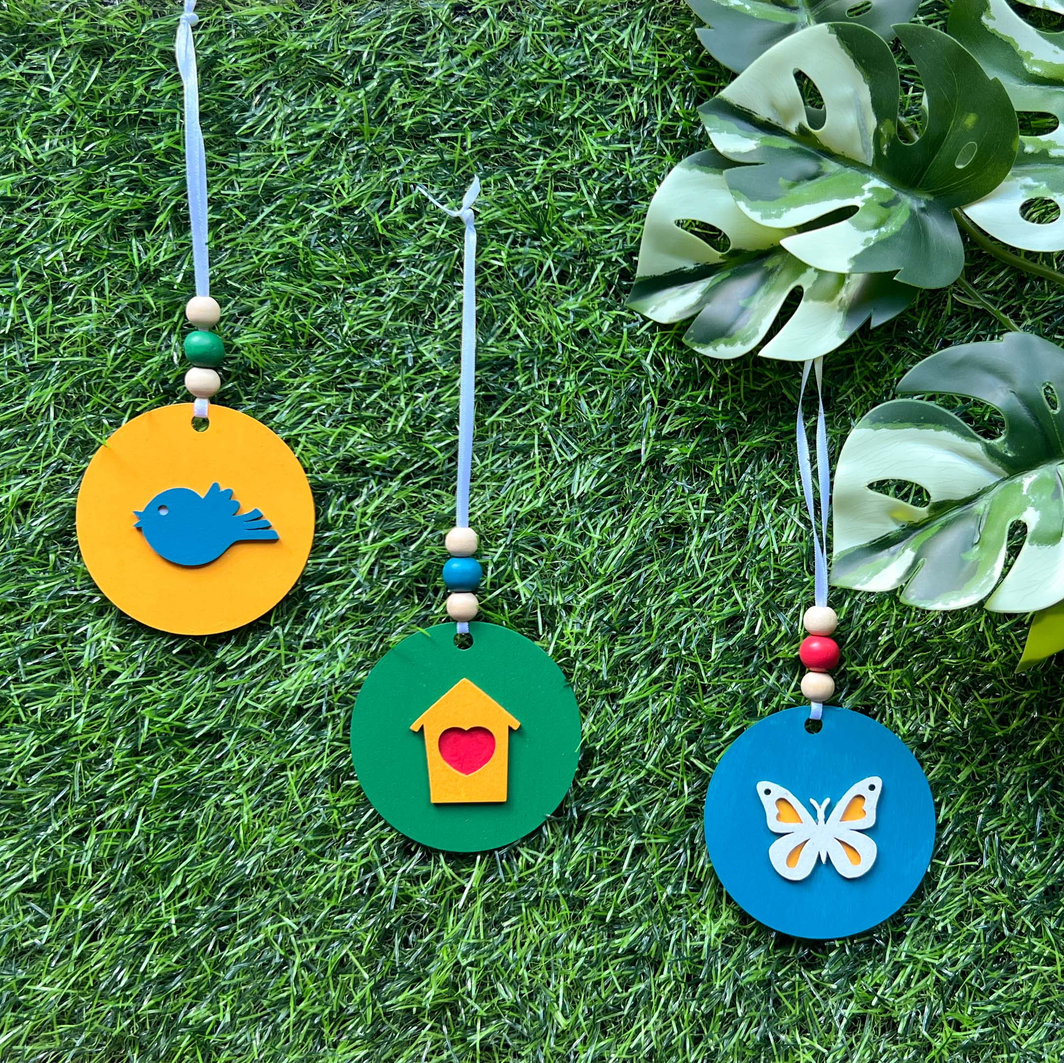 In the Garden Ornament Set. Three ornaments featuring a bird, birdhouse, butterfly. Year-round holiday tree, spring decor or gift.