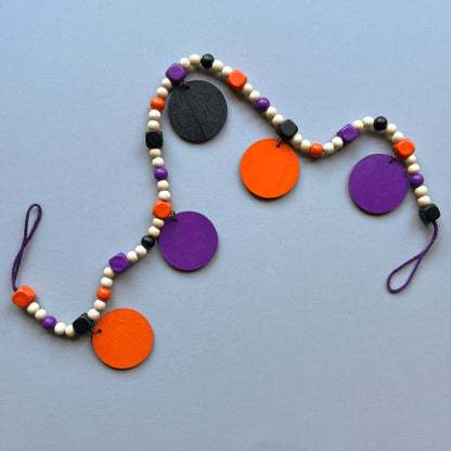 Little Boo Handmade Mini Garland. Features five flat wood circles with a ghost, a witches hat, a "boo" cutout, a jack-o-lantern, or a bat.  Halloween fall seasonal decor and gifts.