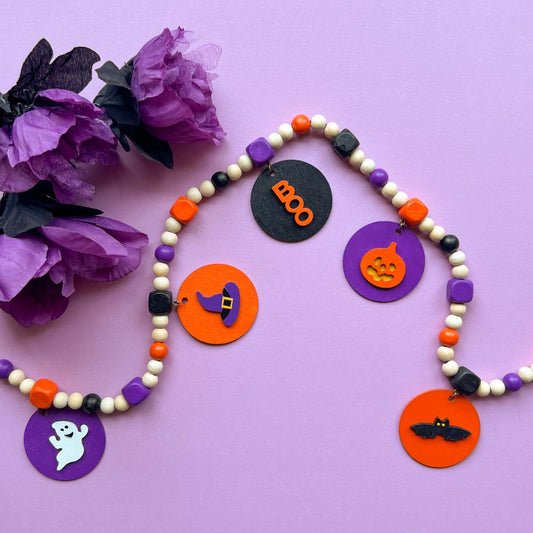 Little Boo Handmade Mini Garland. Features five flat wood circles with a ghost, a witches hat, a "boo" cutout, a jack-o-lantern, or a bat. Halloween fall seasonal decor and gifts.