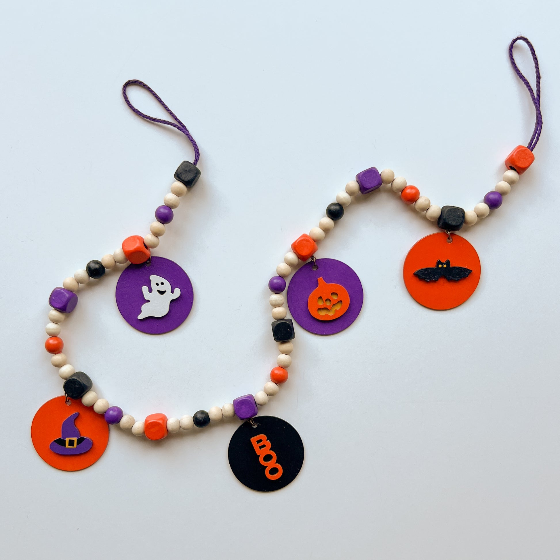 Little Boo Handmade Mini Garland. Features five flat wood circles with a ghost, a witches hat, a "boo" cutout, a jack-o-lantern, or a bat.  Halloween fall seasonal decor and gifts.