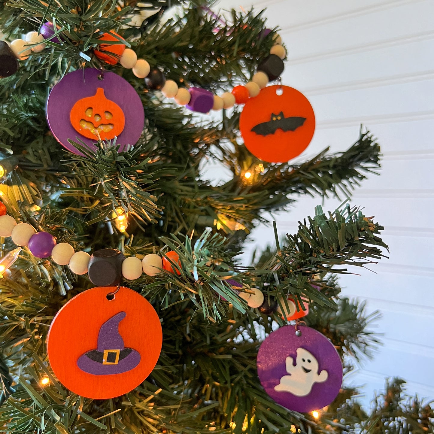 Little Boo Handmade Mini Garland. Features five flat wood circles with a ghost, a witches hat, a "boo" cutout, a jack-o-lantern, or a bat.  Halloween fall seasonal decor and gifts.