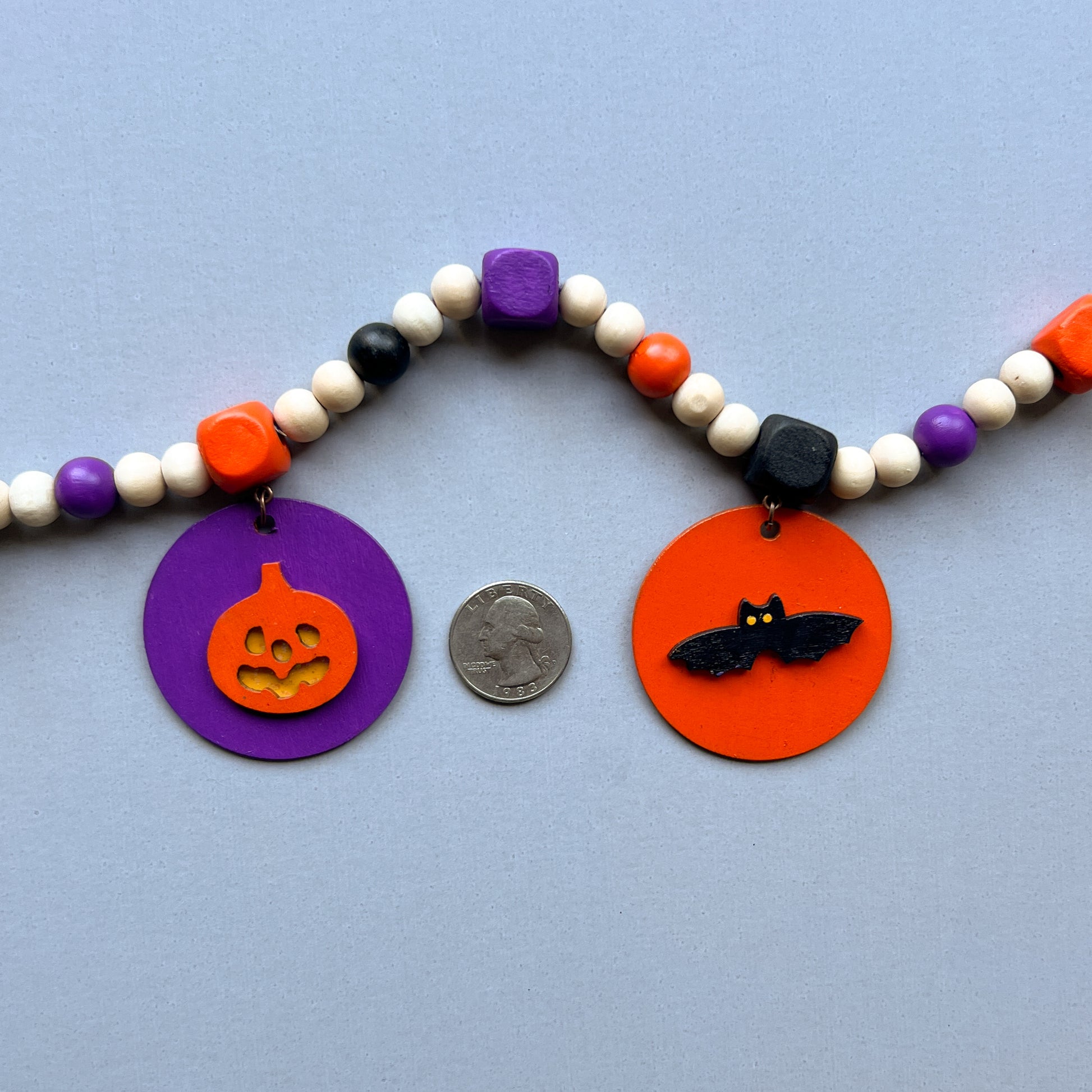 Little Boo Handmade Mini Garland. Features five flat wood circles with a ghost, a witches hat, a "boo" cutout, a jack-o-lantern, or a bat.  Halloween fall seasonal decor and gifts.