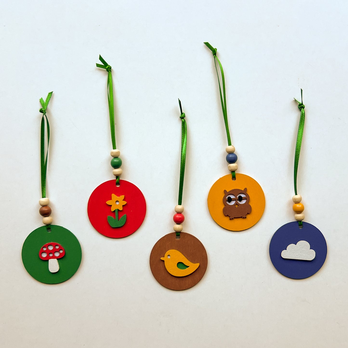 Little Nature Walk Handmade Ornament Set of 5. Ornaments feature  feature nature themed shapes - a cloud, a flower, an owl, a toadstool, or a bird.  Summer or spring decor; tree decoration.