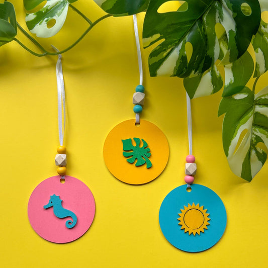 Summer Vacay Ornament Beach Set. Wood ornaments with a seahorse, monstera leaf, or sun. Summer tropical decor or gift; year-round holiday tree decoration.